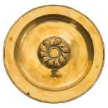 A large brass alms dish: with central floral boss, and triple reeded applied border,