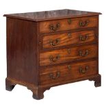 A George III mahogany gentleman's dressing chest: the top with a moulded edge,