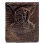Attributed to Claes De Bruyn, a mid 15th Century carved oak Misericord: of a jester in costume,