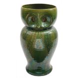 An zoomorphic pottery stick stand: attributed to Bourne Denby and in the form of an owl with