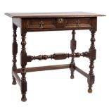 A Charles II oak rectangular side table:, the overhanging top with a moulded edge,