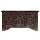 A late 17th Century carved oak rectangular coffer:, with a plain hinged moulded top,