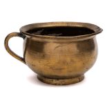 A late 18th/early 19th Century cast brass chamber pot: of traditional design with loop carrying