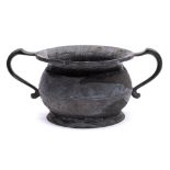 A late 18th/early 19th Century pewter twin-handled chamber pot: of traditional design,