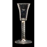 A Dutch wine glass: the pointed funnel shaped bowl on a straight single series air twist stem set
