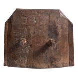 A late 17th/early 18th Century oak bread oven door: of arched form with two projecting handles,