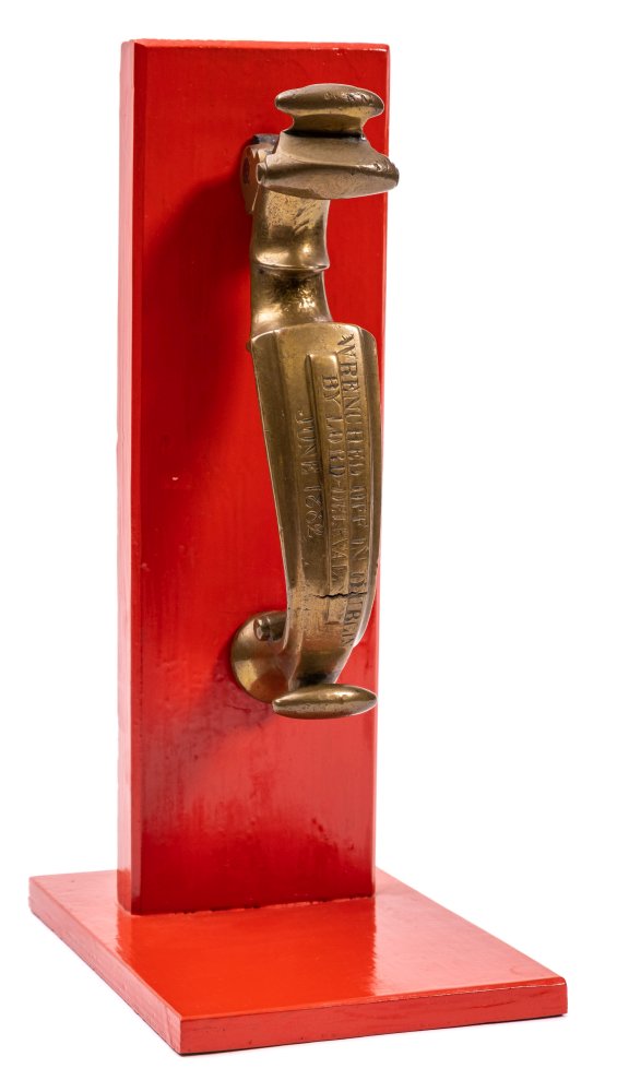 A 19th Century brass Doctor's pattern trophy door knocker: of scroll form,