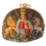 A Victorian patriotic woolwork tea cosy: of domed form, each side displaying the Royal Coat-of-Arms,