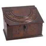 A late 17th Century carved oak box: the sloping hinged lid recycled from an earlier 17th Century