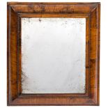 An early 18th Century walnut cushion framed mirror:, with original rectangular bevelled plate,