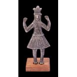 A South American silver Talisman figure: wearing traditional feathered headdress and feather skirt,