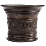 An early 18th Century mortar: cast H O 1707 and banded decoration of birds and animal,