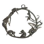 A 19th Century Chinese cast bronze bamboo hoop: decorated with frolicking monkeys, unsigned, 24cm.