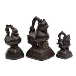 A group of three Burmese bronze 'duck' opium weights: of graduated size and traditional form,