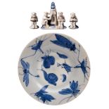 An Arita porcelain dish and group of miniature toys: the former painted in blue with insects,