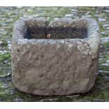 A stone trough: of irregular oblong shape - possibly Heavitree stone,
