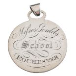 A circular silver school badge of merit: for 'Misses Gould's School, Rochester',