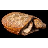 A West African Akan Ashanti ceremonial ivory turtle: the shell carved with a cross-hatched 'Kente'