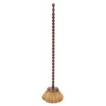 A rare early 18th Century maid's broom: with circular head and walnut barley-twist turned handle,