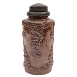 A Derbyshire saltglazed brown stoneware snuff jar: sprigged in relief with vines and flower heads,