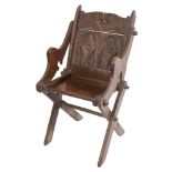 A rare Elizabeth I oak Glastonbury armchair:, of pegged construction,