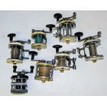 A group of six Mitchell 600 series salt water reels: and an Ambassador 'Mag III' reel.