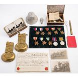 A collection of various militaria:, including WWII service medals, buttons,