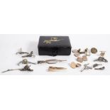 A pair of flintlock pistol cufflinks:, together with a group of pistol and firearms lapel badges,