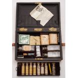 An early 20th century leather cased apothecary's set by Army & Navy, London:,