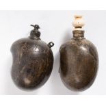 Two Islamic bronze powder flasks: of globular kidney shaped form , one with ivory stopper,