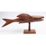 A Pitcairn carved wooden model of a flying fish ' unsigned:, open mouth and inlaid eyes,