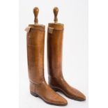 A pair of brown leather riding boots and trees by Peal & Co, London:,