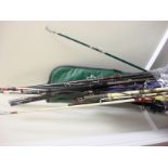 A collection of mid to late 20th century fishing rods,: both fresh and saltwater rods,