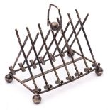 A plated six-division toast rack: of arched outline, in the form of crossed croquet mallets,