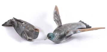 Two early 20th century carved and painted wood pigeon decoys:,