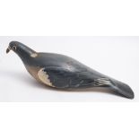 A painted wooden pigeon decoy:, 34cm long.