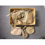 A small collection of brown leather and canvas game and cartridge bags:,