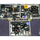 A collection of various 35mm cameras and equipment:, including lenses,