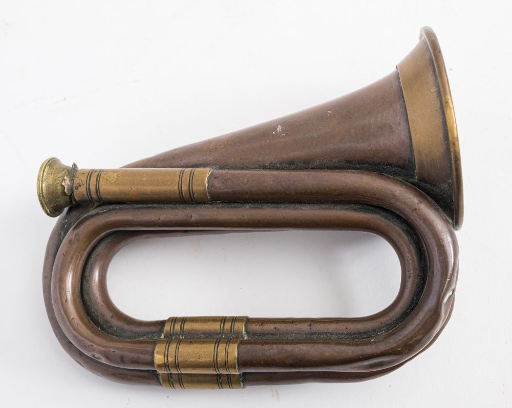 A copper and brass mounted post horn:, unsigned, 16cm long.