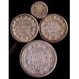 An 1813 three shilling bank token and two one and sixpence bank tokens 1812 and 1815.