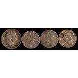 An 1817 George II shilling, two 1787 sixpences and a 1757 sixpence:.