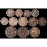 Twelve silver English coins.