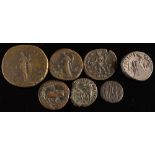 A group of seven various Roman coins:.