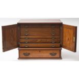 An Edwardian oak collector's cabinet:,