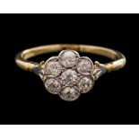 An early 20th Century diamond circular cluster ring: millegrain-set with round diamonds estimated