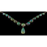 An opal mounted necklace: of graduated oval opal doublets and opals with black painted backs and