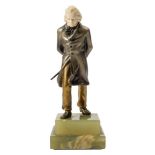 An Art Deco period bronze and ivory figure of Beethoven: wearing a frock coat with hat and walking