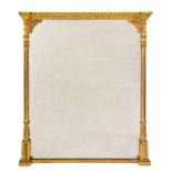 A 19th Century carved giltwood overmantel mirror: with a leaf decorated cornice of recessed broken