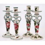 Two pairs of Wemyss Kintore pottery candlesticks: one pair decorated with pink cabbage roses and