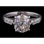 A diamond single-stone ring: the cushion-shaped old brilliant-cut diamond approximately 8.